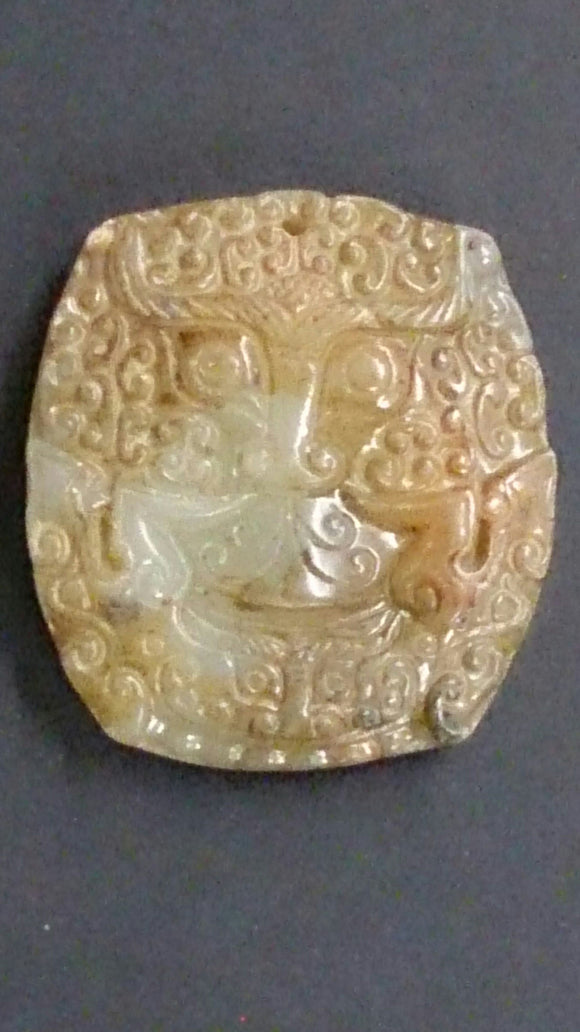 Pendant, White Jade & Light Brown, Hand-Carved Relief, Dragons Face - Roadshow Collectibles