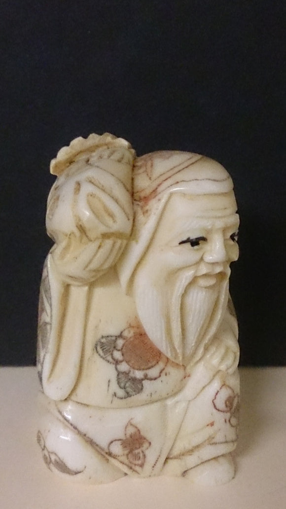 Netsuke, Carved Bone, a Bearded Old Man Holding a Fish, Japanese - Roadshow Collectibles