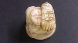 Netsuke, Carved Bone, a Bearded Old Man Holding a Fish, Japanese - Roadshow Collectibles